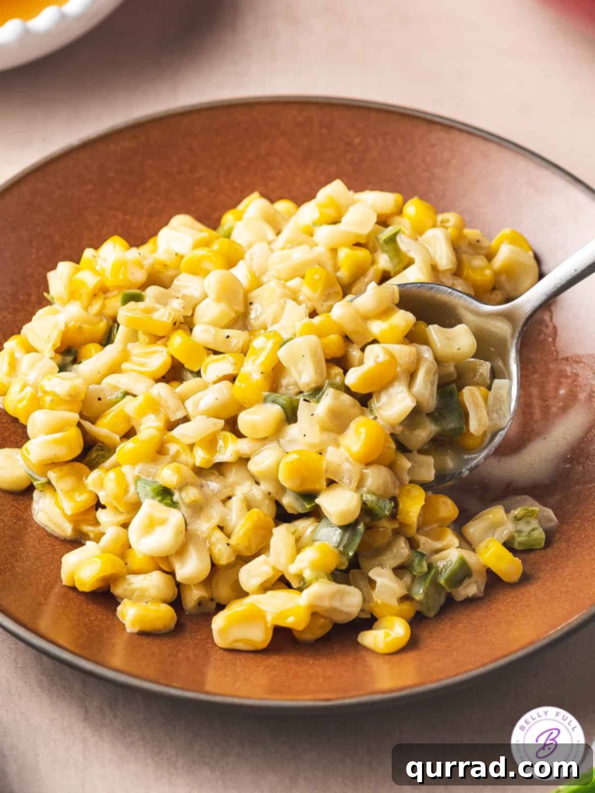 Honey Butter Kissed Skillet Corn 4 spoonful of creamy honey butter skillet corn
