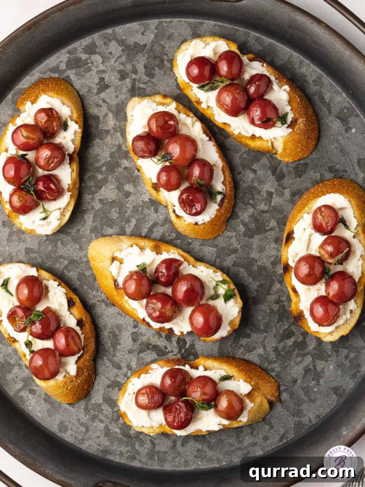 Oven Kissed Grapes 4 plate of crostini with red grapes and ricotta