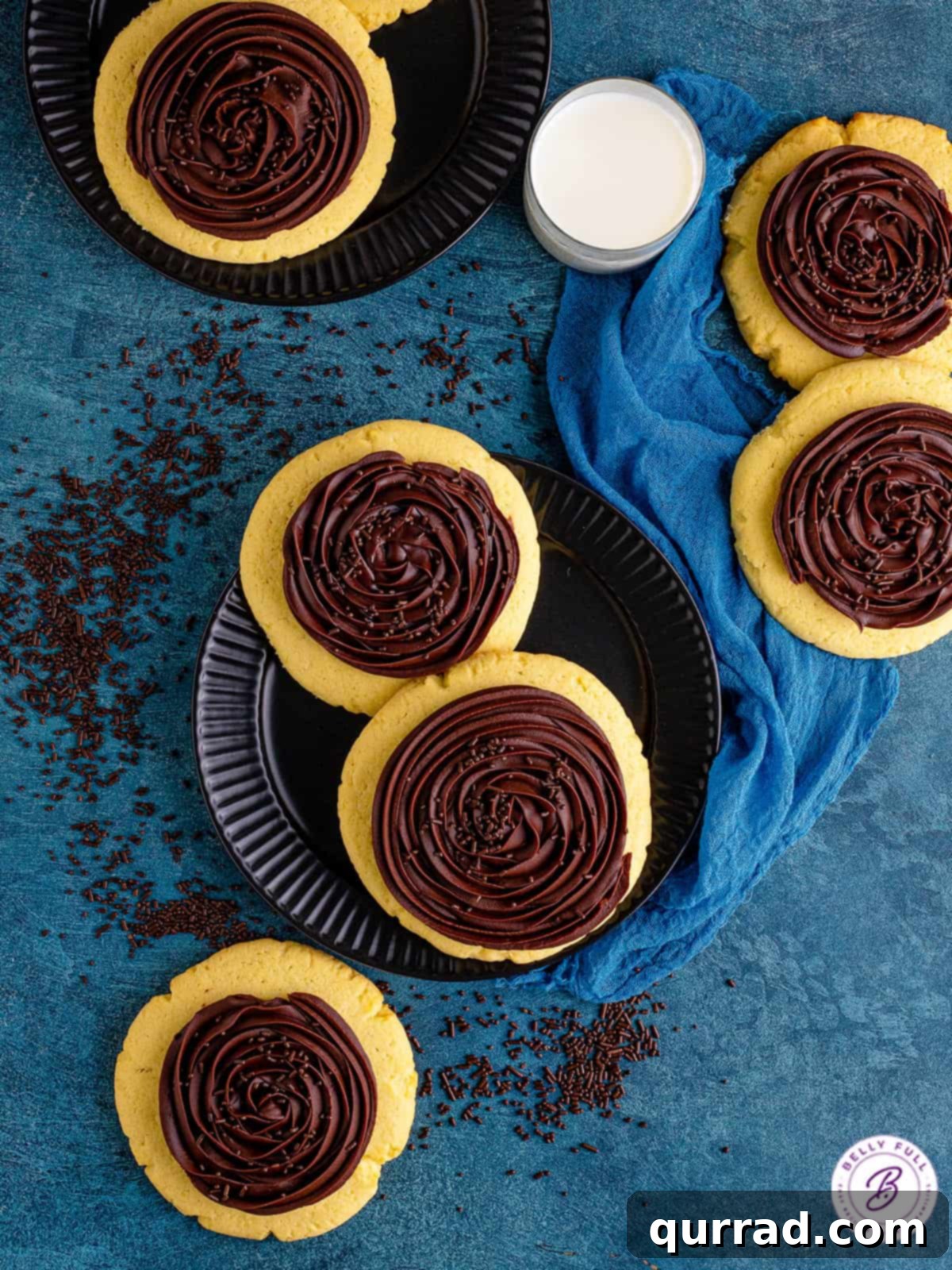 Perfectly frosted Crumbl chocolate cupcake cookies ready to enjoy. Overhead view of several Crumbl chocolate cupcake cookies arranged neatly.
