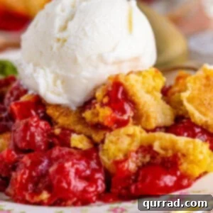 Close up of cherry dump cake with a serving of vanilla ice cream