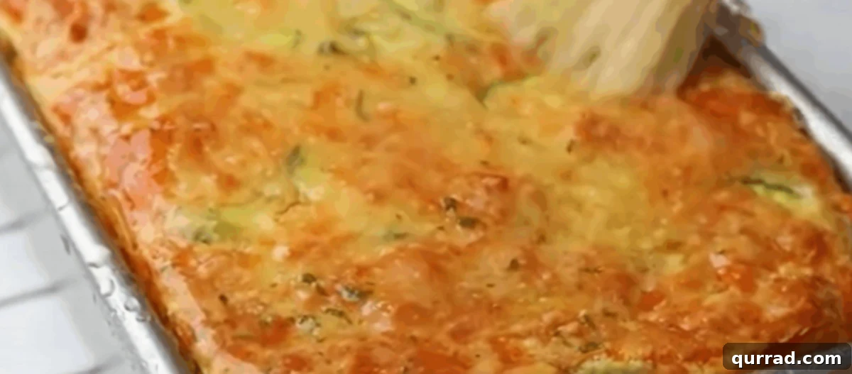 Brushing the zucchini bread with the topping.