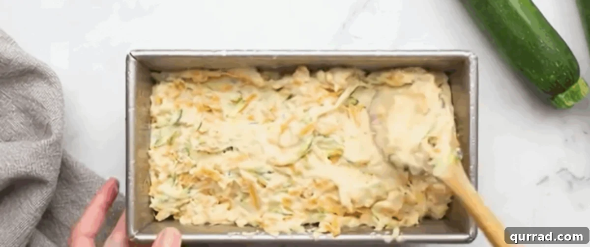 Transferring the dough to a loaf pan.
