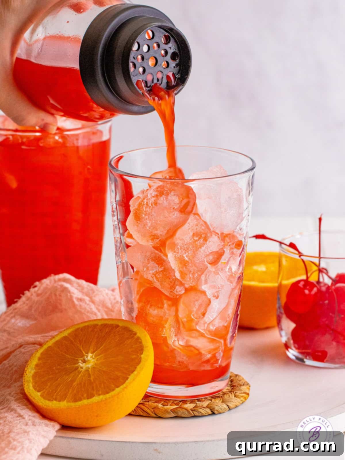 Made with 3 liqueurs and orange juice, an Alabama Slammer is a fruity and sweet cocktail that packs a punch! It's perfect for sipping! Pouring Alabama Slammer into a glass