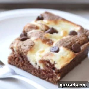marble cheesecake square on plate with fork