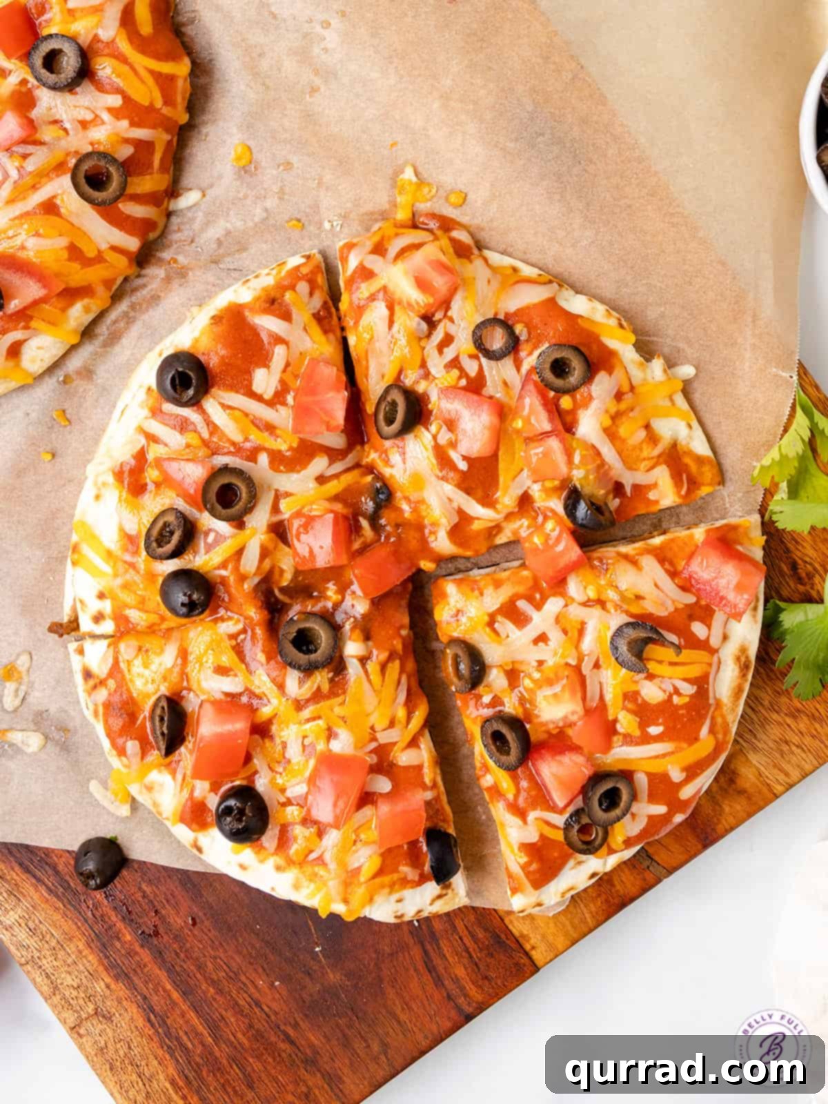 Overhead view of a Mexican pizza cut into quarters