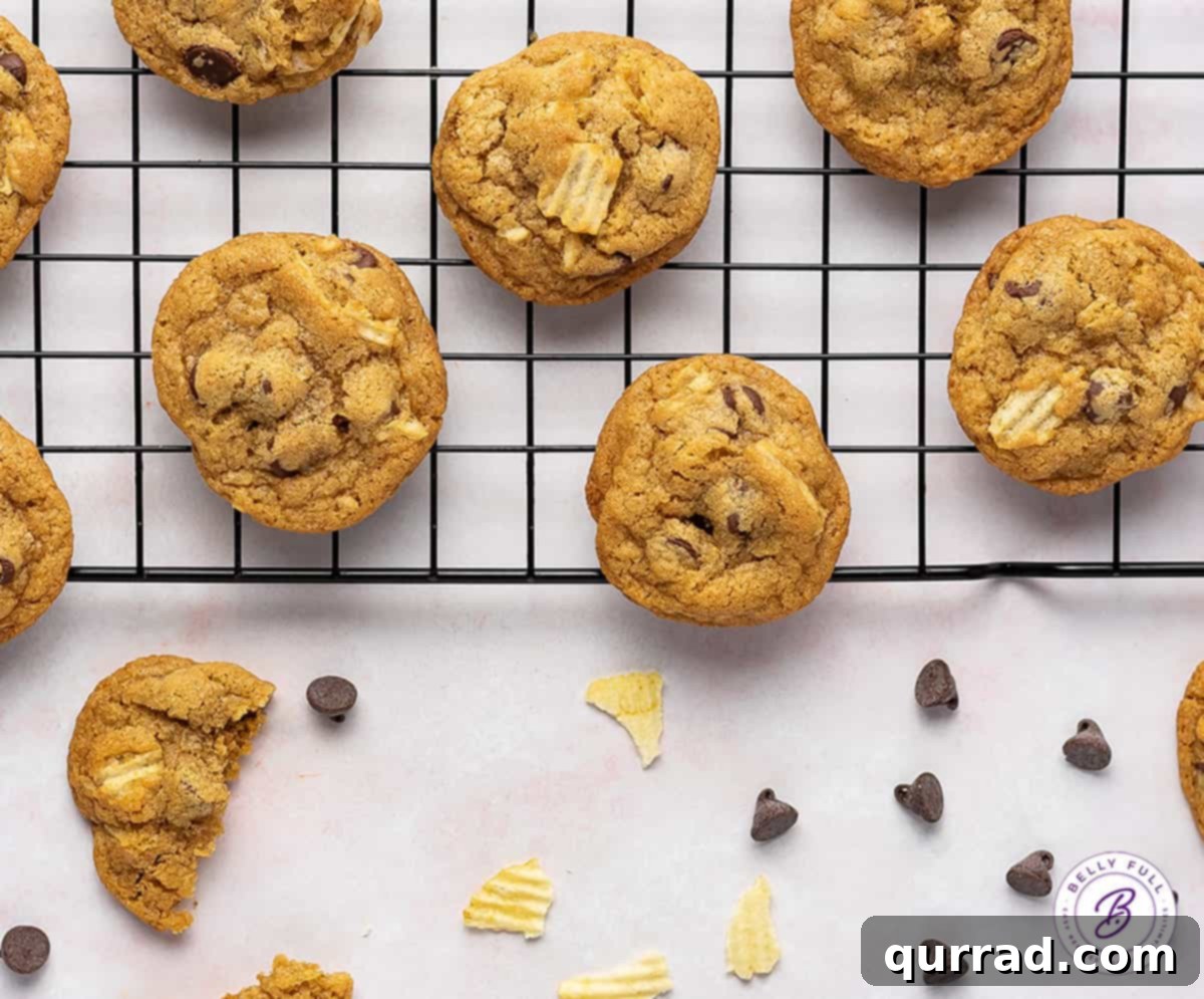 Loaded with semi-sweet chocolate chips and crunchy pieces of chips, these Potato Chip Cookies are exactly what you didn't know you need! Overhead view of potato chip cookies cooling on a wire rack, perfectly golden brown.