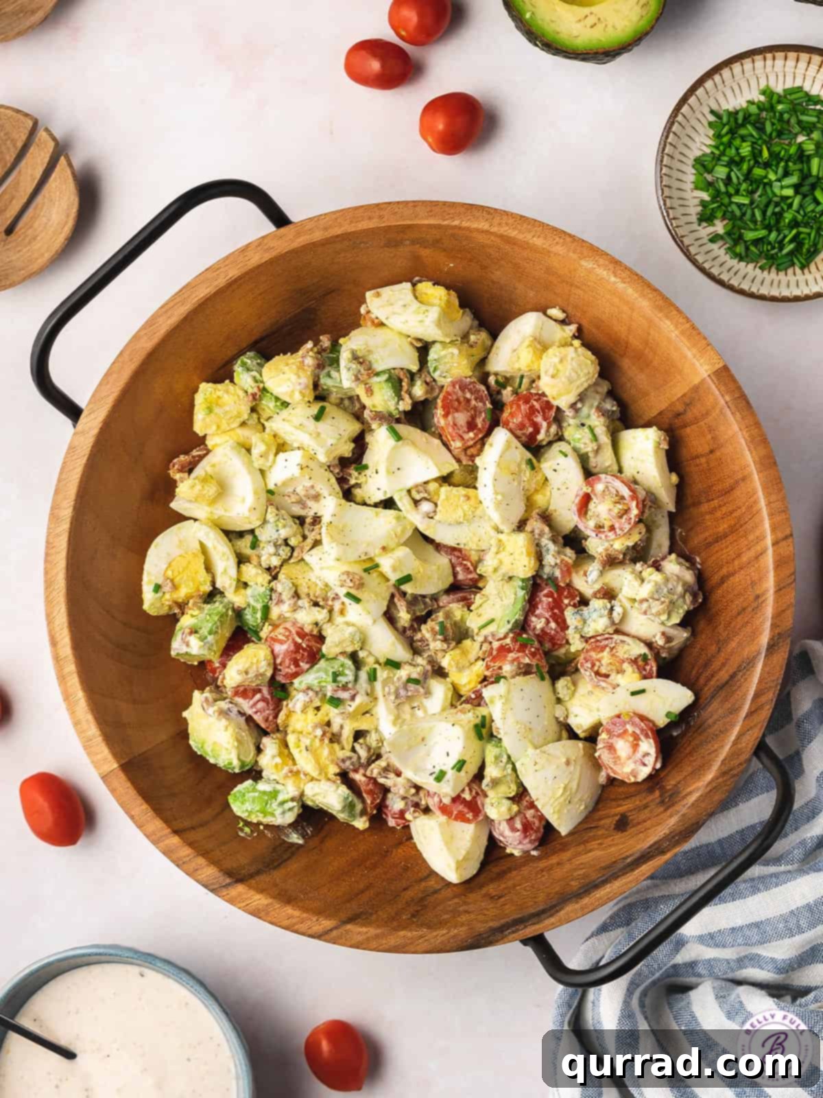 Ultimate Cobb Egg Salad 3 cobb egg salad mixed together in brown serving bowl