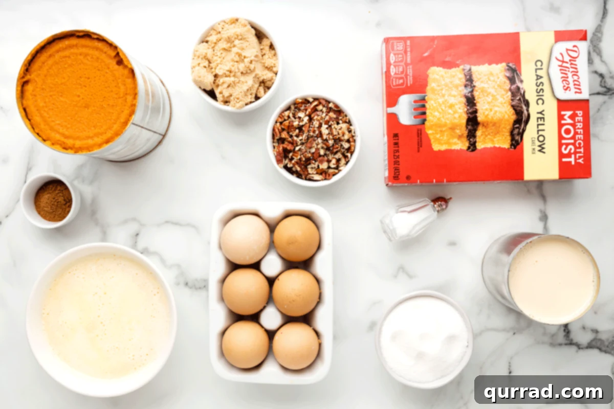 Golden Pumpkin Spice Streusel Bake 3 All the ingredients for pumpkin dump cake laid out on a kitchen counter, including canned pumpkin, evaporated milk, sugars, eggs, cake mix, and pecans.