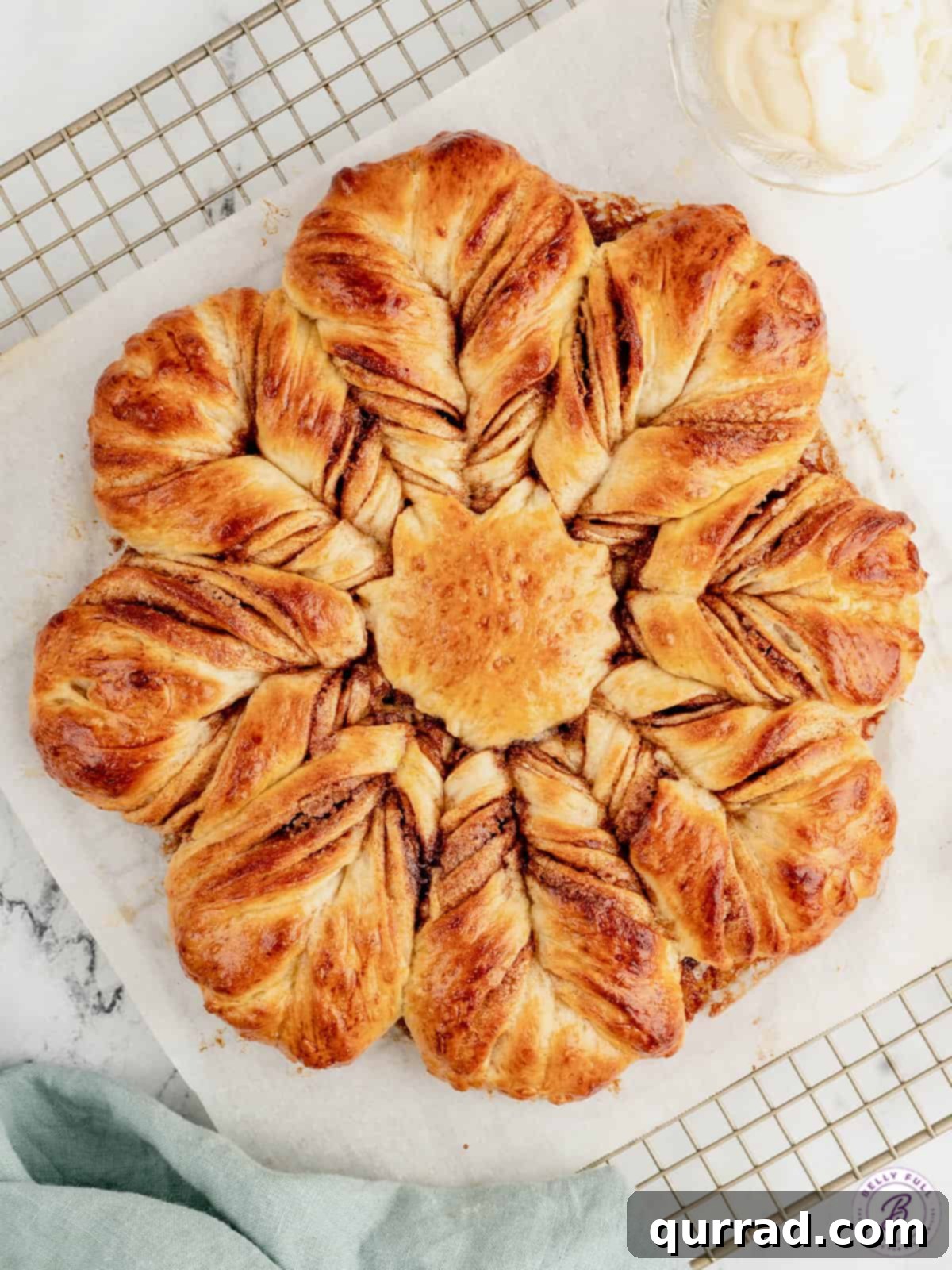 Cinnamon Sugar Star Bread, a festive holiday treat that's easier to make than it looks. Overhead view of cinnamon sugar star bread, beautifully twisted and golden brown