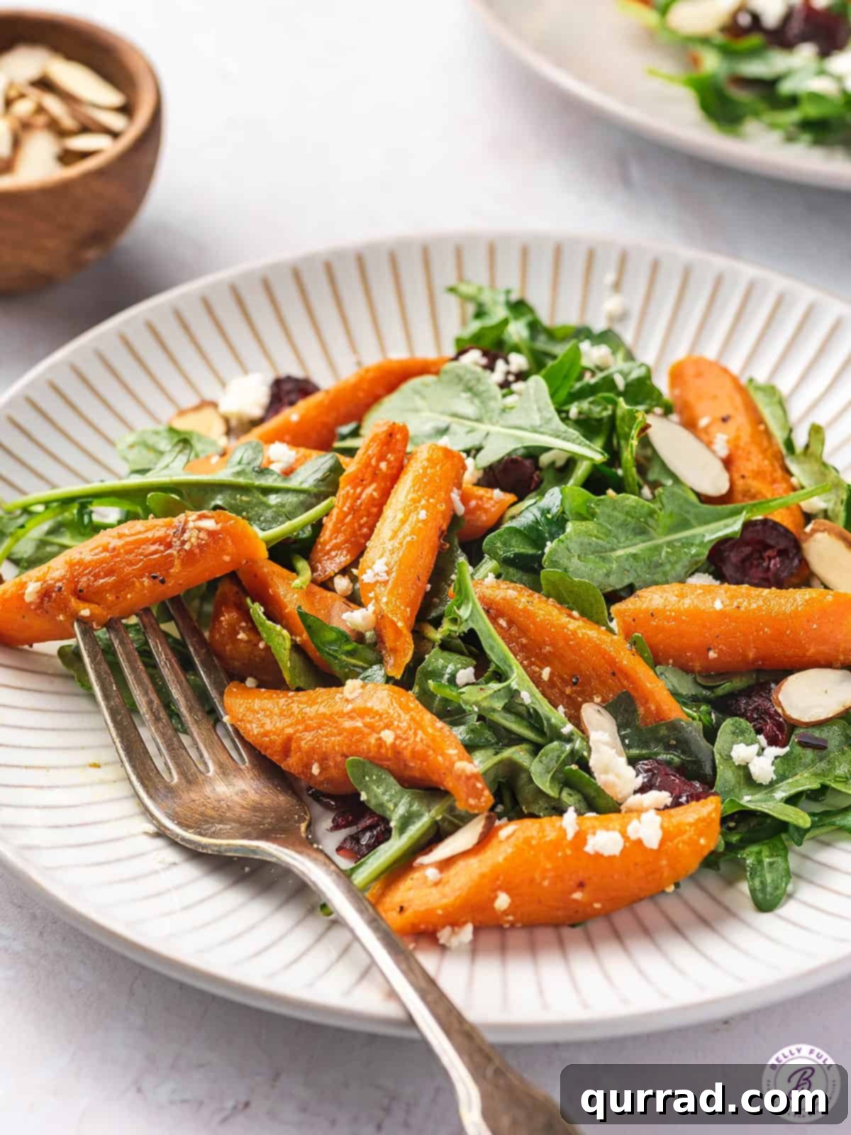Roasted carrot salad on a white plate