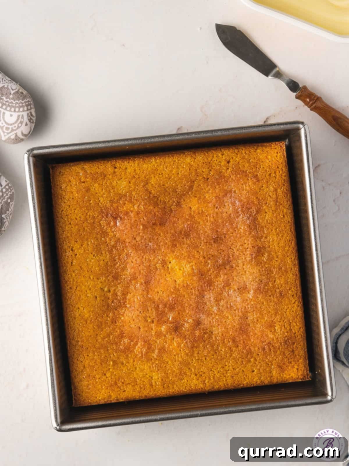Overhead view of brown sugar cornbread in a square baking dish