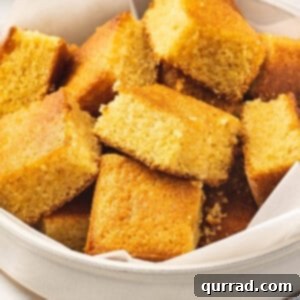 cut up portions of brown sugar cornbread in white bowl