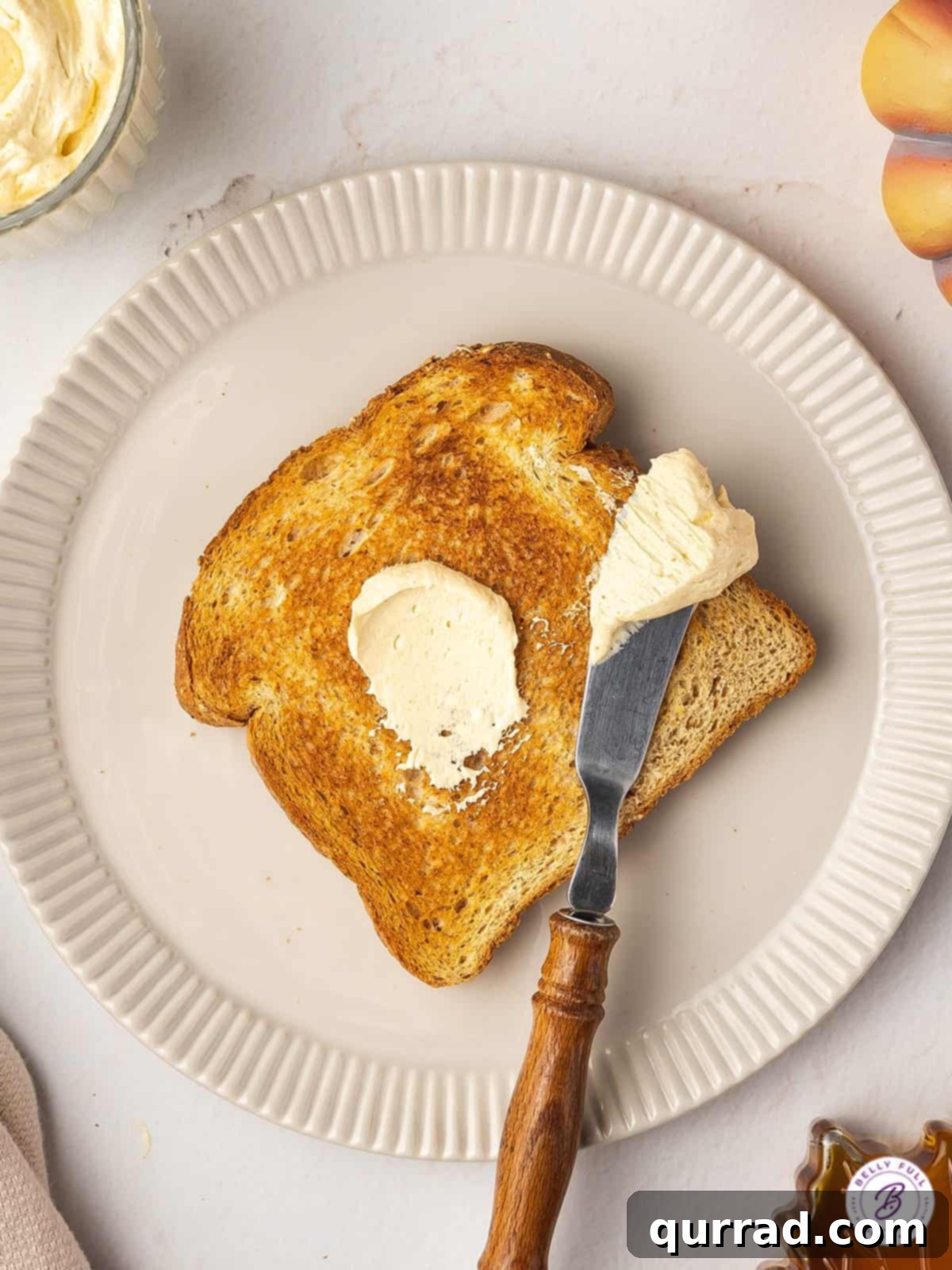 Fluffy Spiced Pumpkin Butter 4 overhead swipe of butter on knife and toast