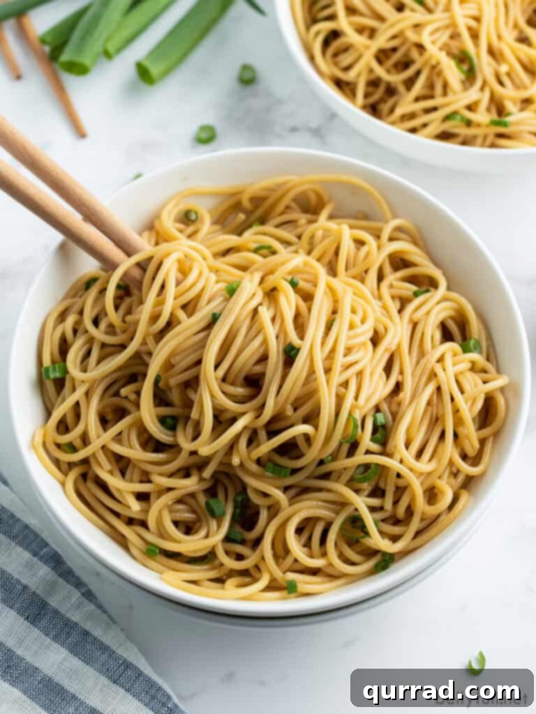 Simply Delicious Sesame Noodles 2 sesame noodles in bowl with chopsticks, ready to eat