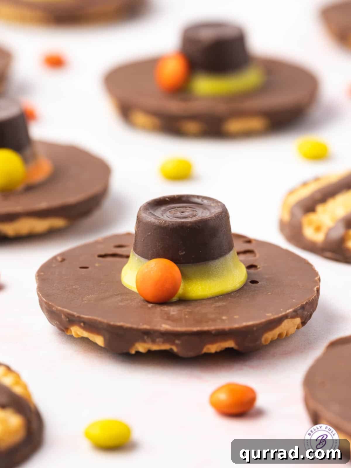 A close-up of a single Pilgrim Hat Cookie, highlighting the intricate details of the buckle and hat band.