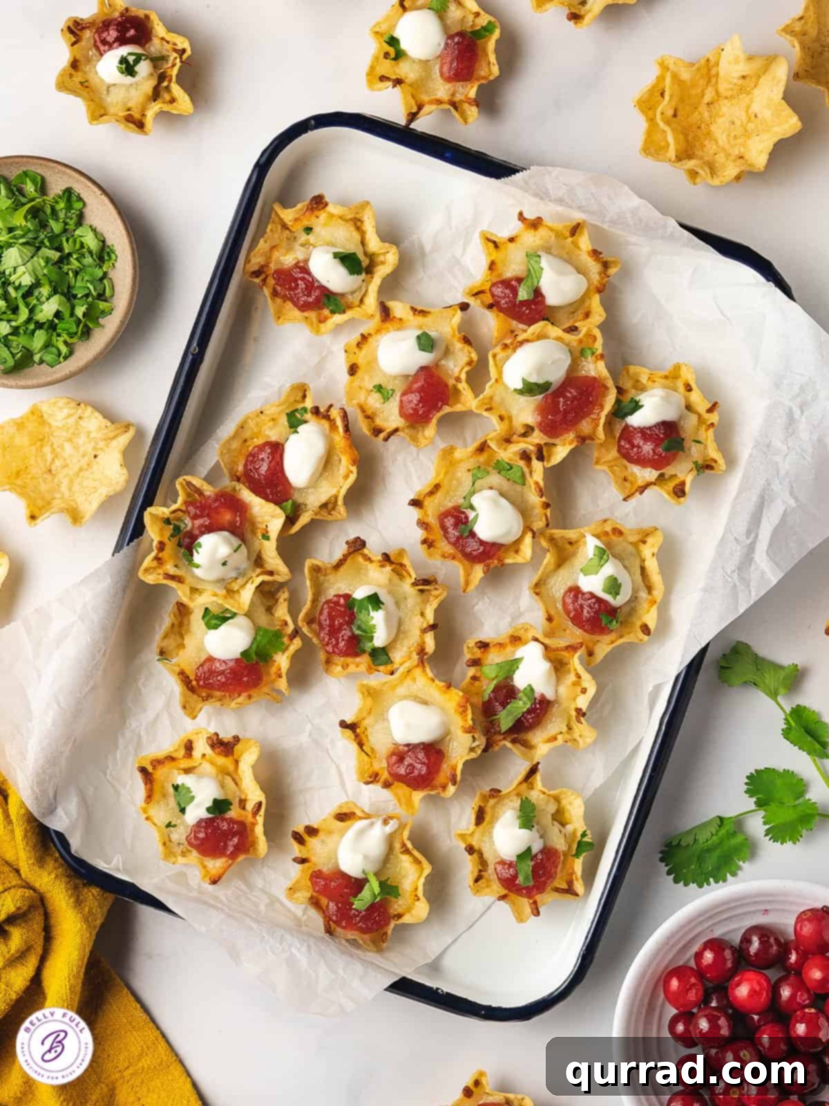 The perfect mix of Tex-Mex and Thanksgiving flavors in every bite, these Thanksgiving Nachos are a great way to use Thanksgiving leftovers. Overhead view of Thanksgiving leftover nachos arranged on a platter, ready to serve.