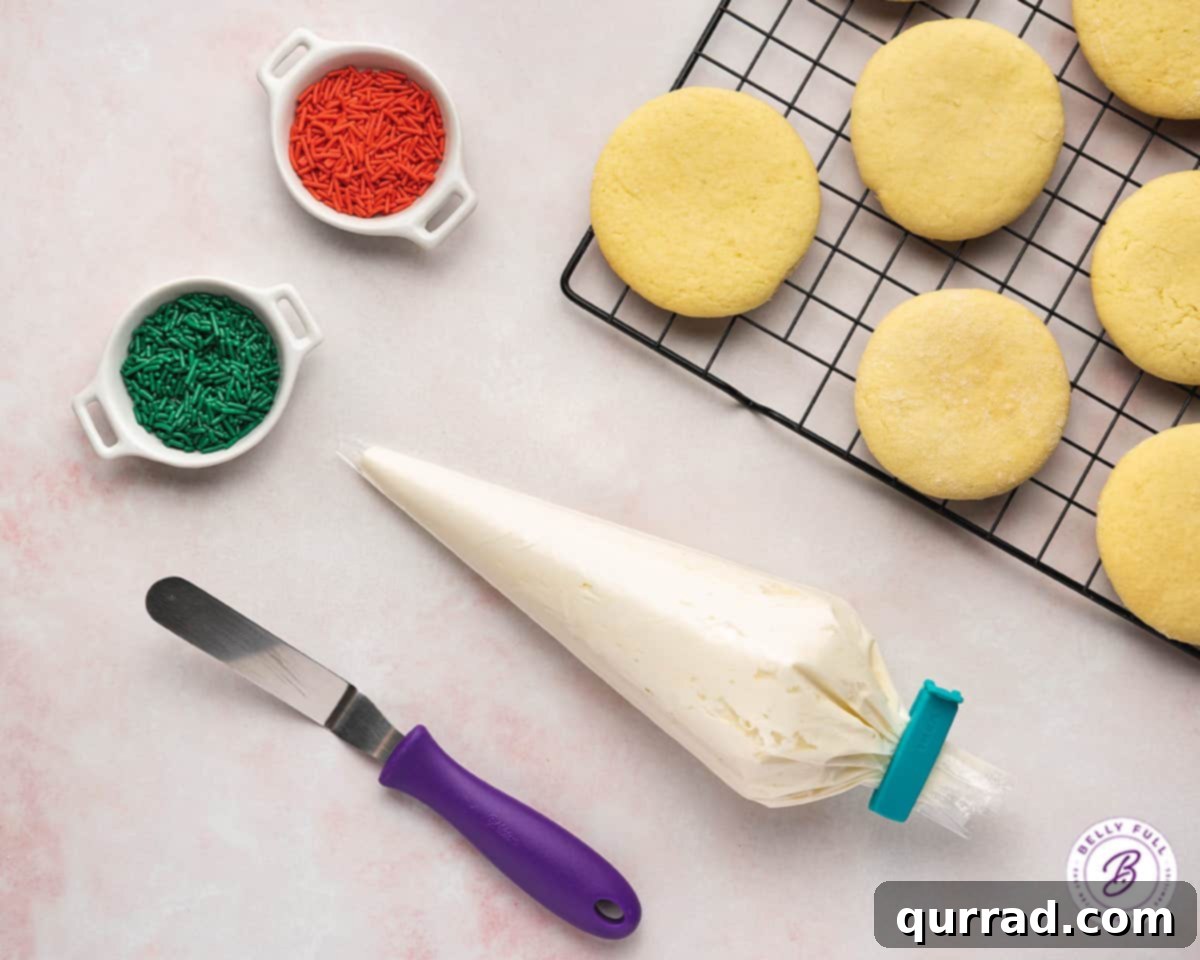 Lofthouse Inspired Soft Sugar Cookies 7 A piping bag of frosting, Lofthouse cookies, and sprinkles ready for decorating.