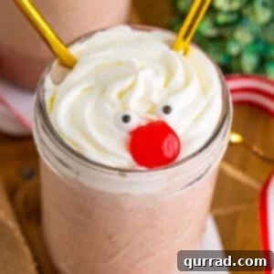 Rudolph's Red-Nosed Revelry 3 A Drunk rudolph cocktail in a mason jar