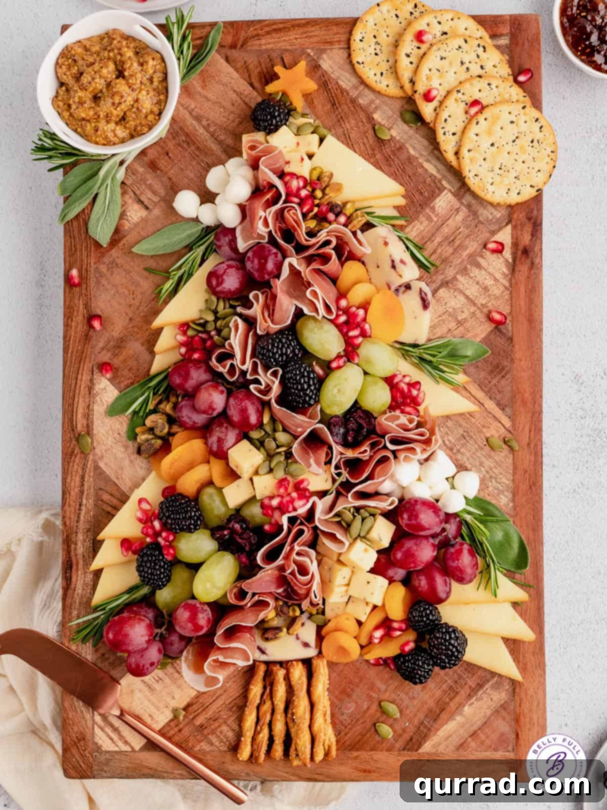 A stunning overhead view of the finished Christmas Tree Charcuterie Board, ready to be served and enjoyed. An overhead shot of a completed Christmas Tree Charcuterie Board, showcasing its beautiful arrangement of ingredients.