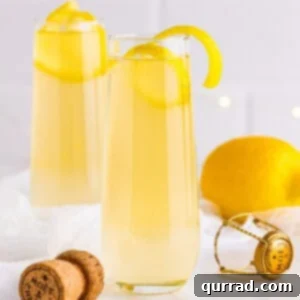 A French 75 garnished with a lemon twist