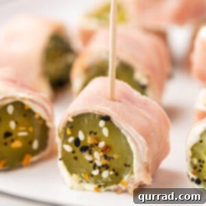 Dill Pickle Ham Pinwheels 2 A dill pickle roll up with a toothpick on a plate