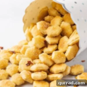 A cup of spilled oyster crackers with crushed red pepper flakes