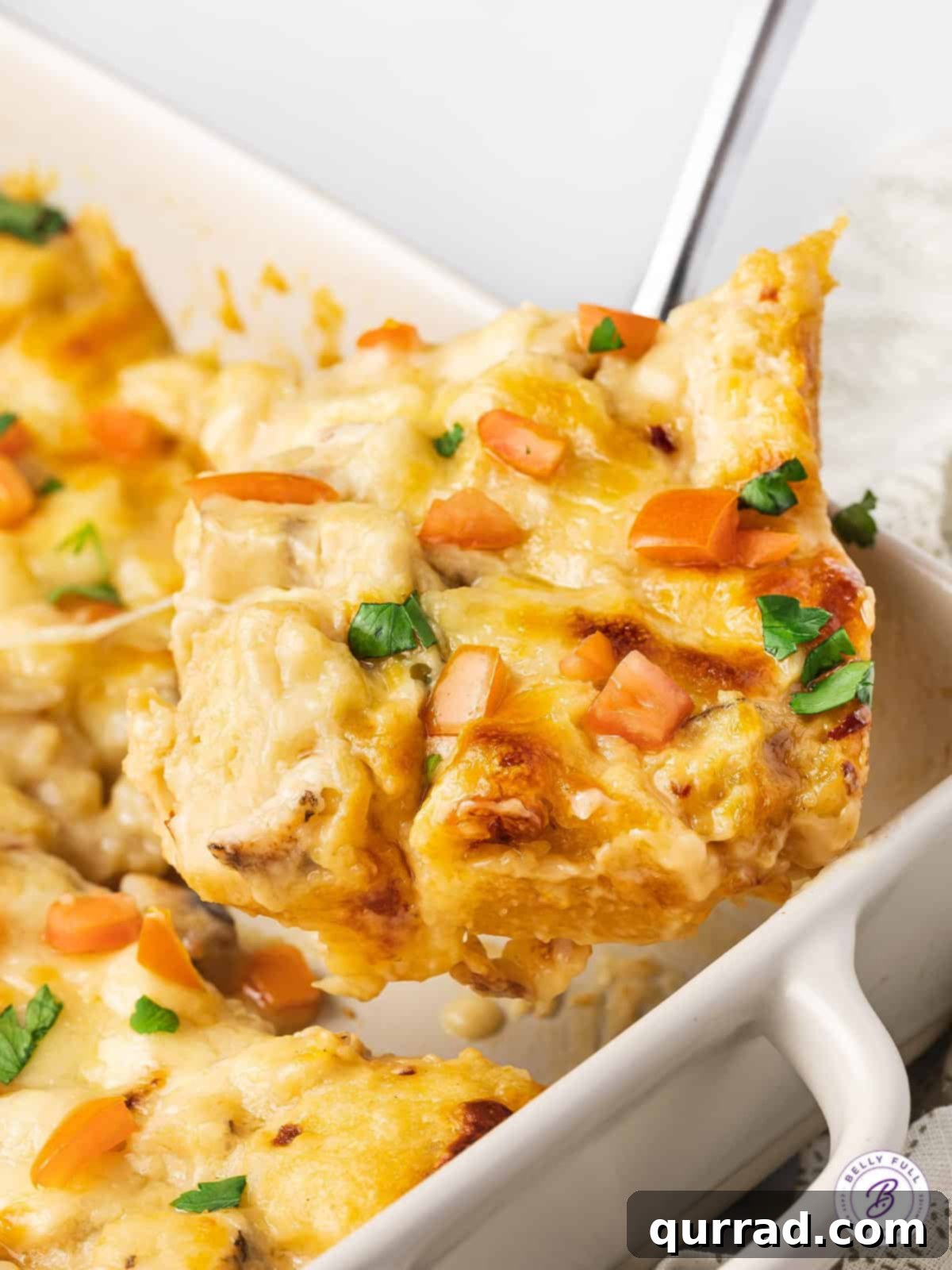Made with biscuits, chicken breast, and homemade alfredo sauce, this Chicken Alfredo Bubble Pizza makes a quick and easy weeknight dinner. A slice of chicken alfredo bubble up being served