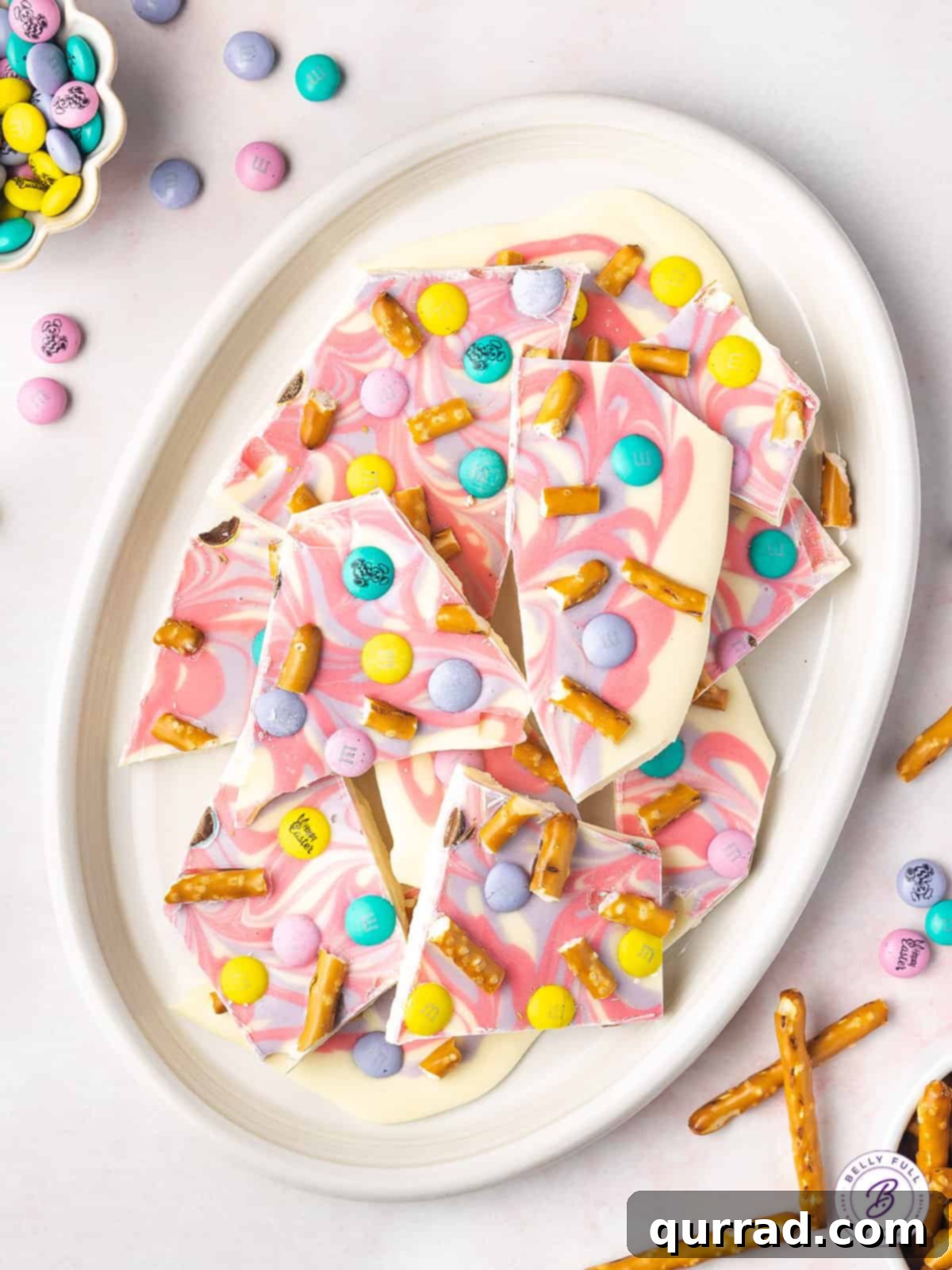 Whimsical Easter Bark 2 Pastel colored chocolate bark on white serving platter