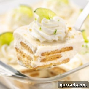 A slice of lime icebox cake on a spatula, ready to be served.