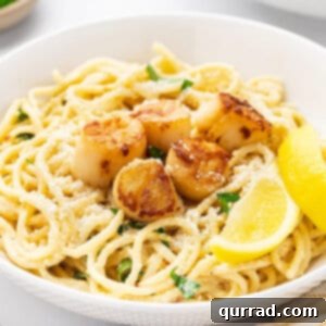 Seared scallop piccata with spaghetti in a bowl