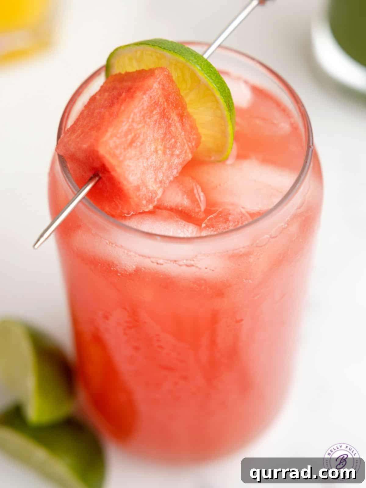 Refreshing Fruit Infusions 4 A beautifully presented glass of watermelon Agua Fresca, garnished with a small watermelon cube on the rim.