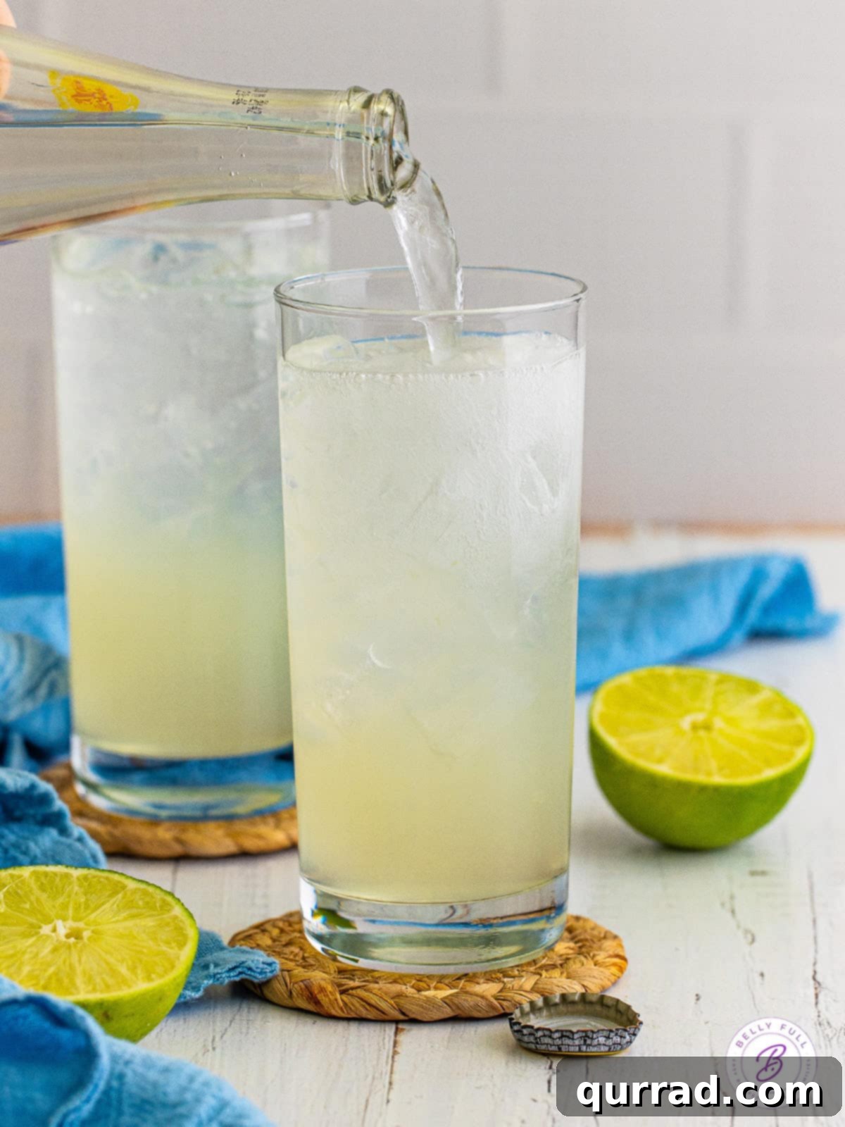 Texas Ranch Water Refresher 4 Topo Chico being poured into a ranch water cocktail glass