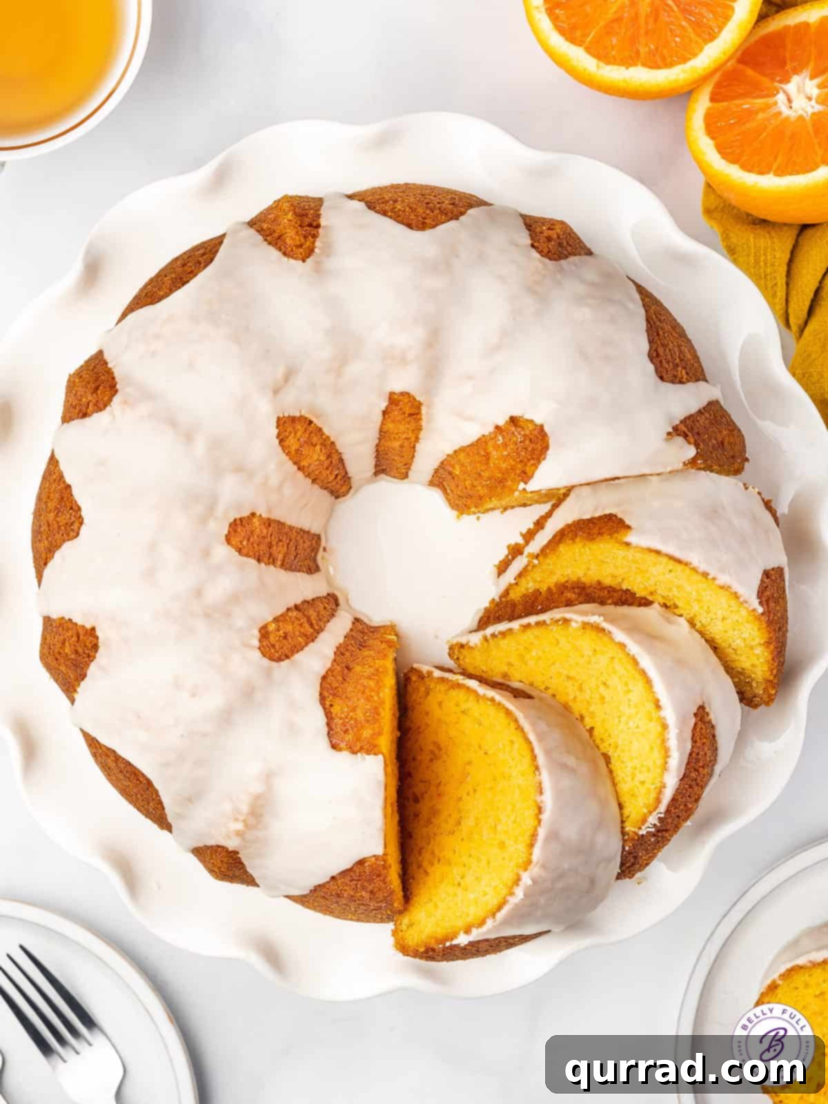 overhead sliced orange creamsicle cake with glaze