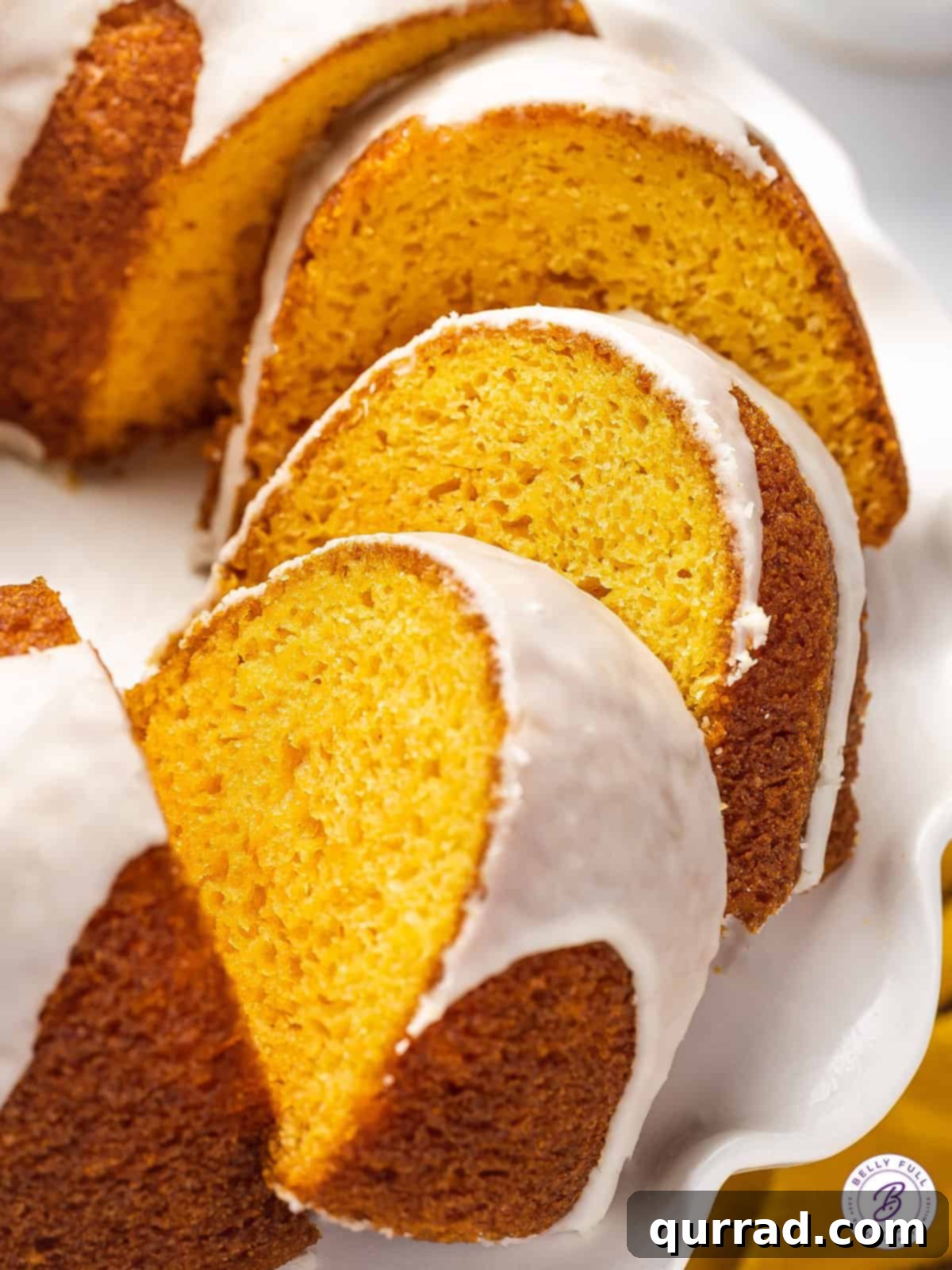 3 overlapping slices of orange glazed cake