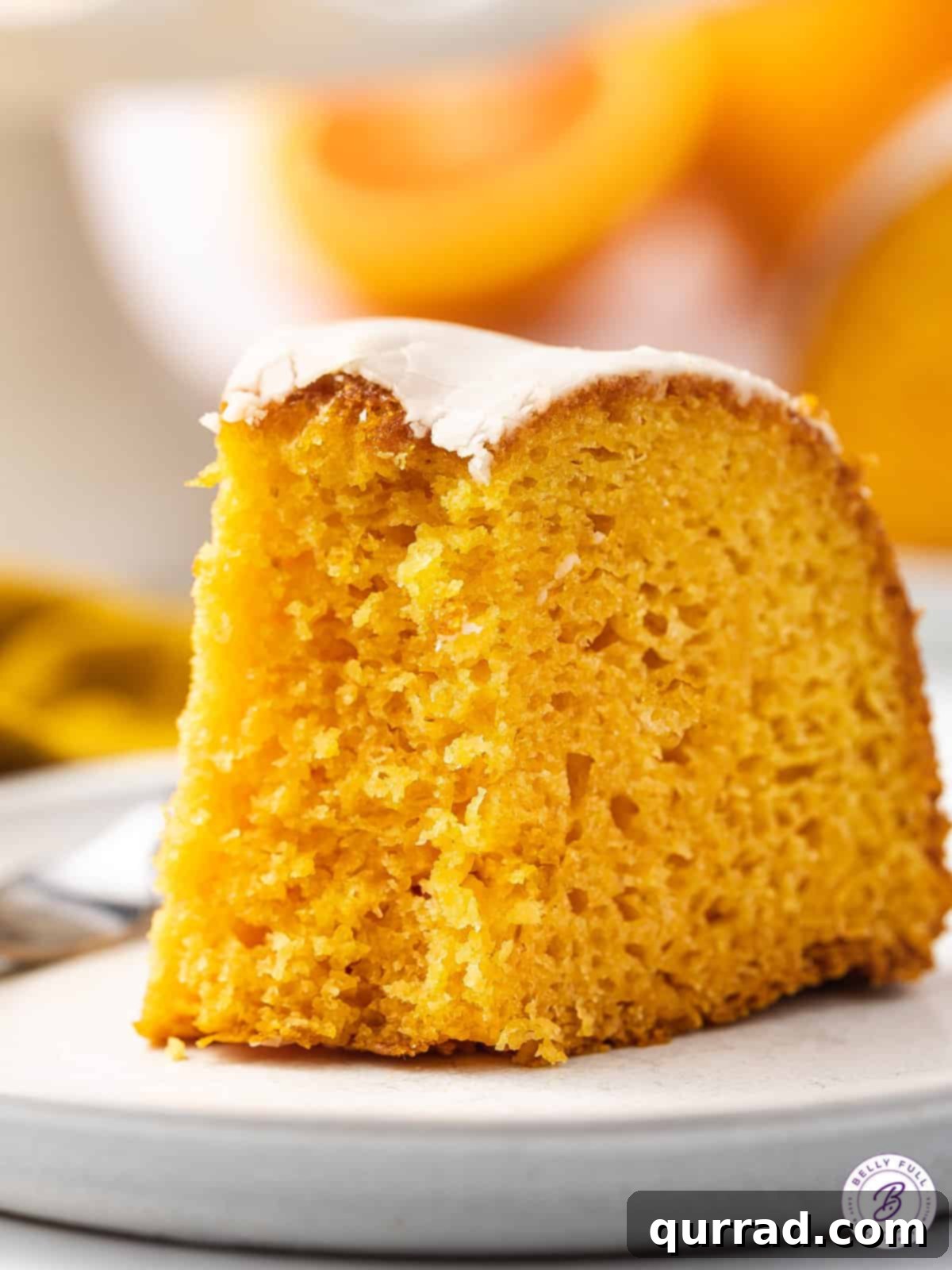slice of orange cake with bite taken