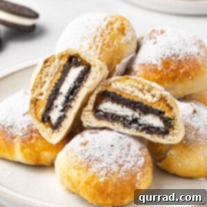A pile of air fryer fried Oreos, with one cut in half to show the inside