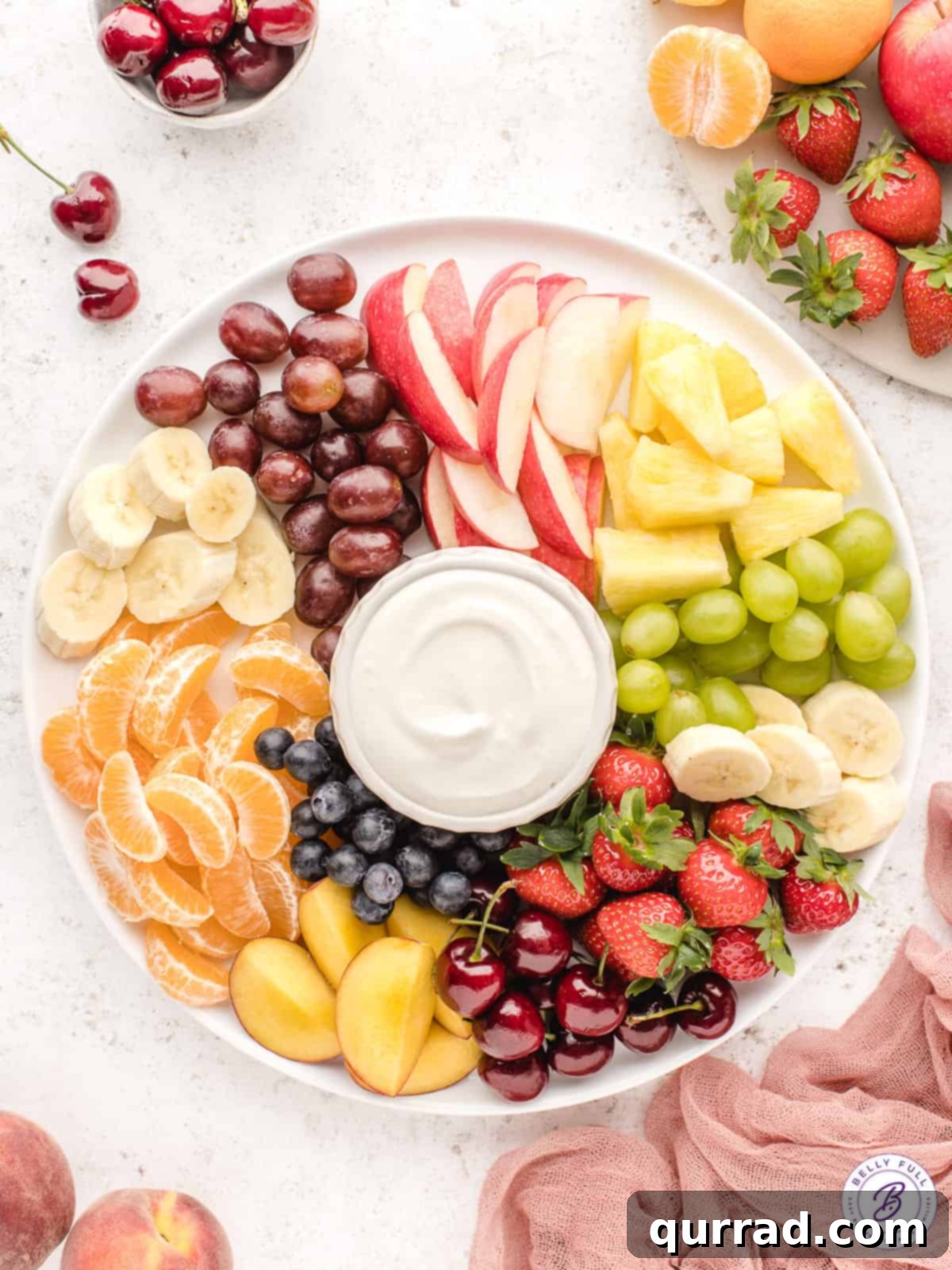 Creamy Fruit Delight 2 overhead fruit dip on serving platter with cut fresh summer fruit