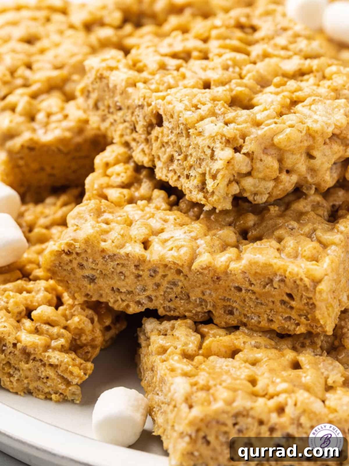 close up stack of cookie butter rice krispies treats