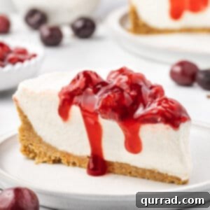 A slice of no bake cherry cheesecake on a plate