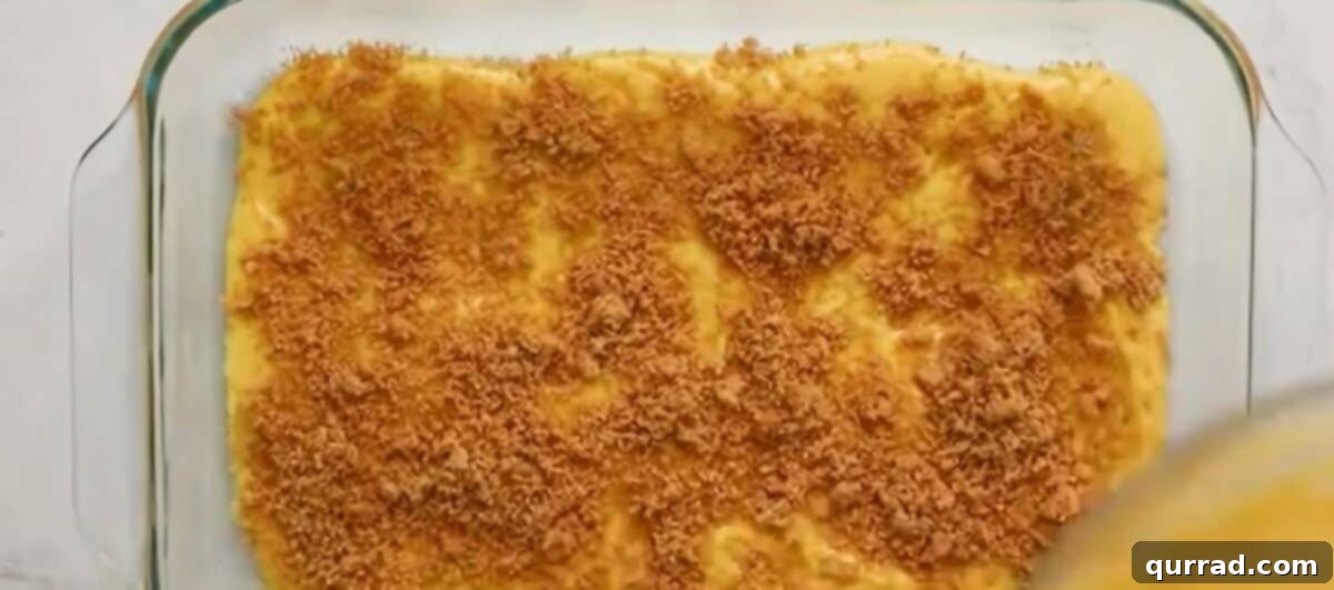 Layering the cake with the cinnamon brown sugar swirl in a baking pan.