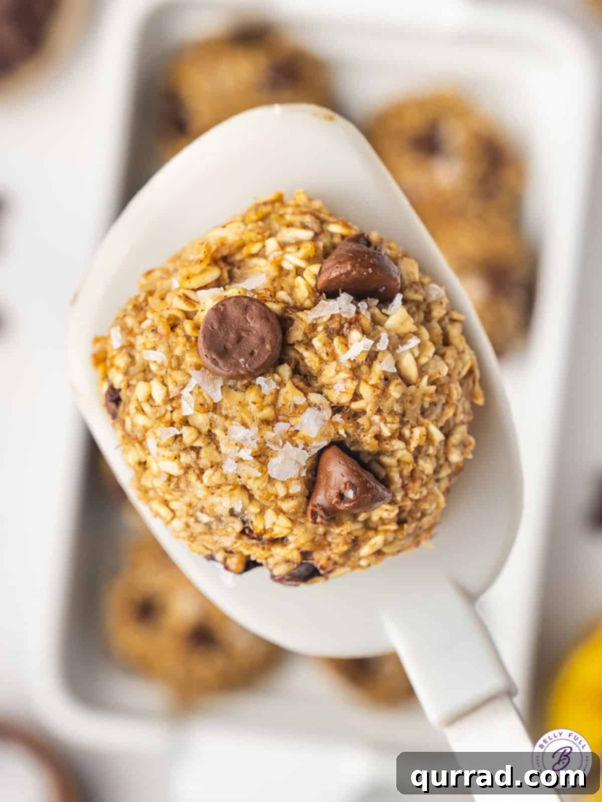 Perfectly Baked Banana Oatmeal Cookie A single banana oat cookie resting on a spatula, ready to be enjoyed.