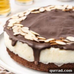 A delicious slice of Almond Joy cake, highlighting the layers of brownie, coconut, and chocolate.