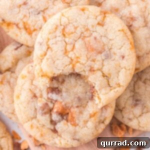 Overhead view of butterfinger pudding cookies, with a bite missing