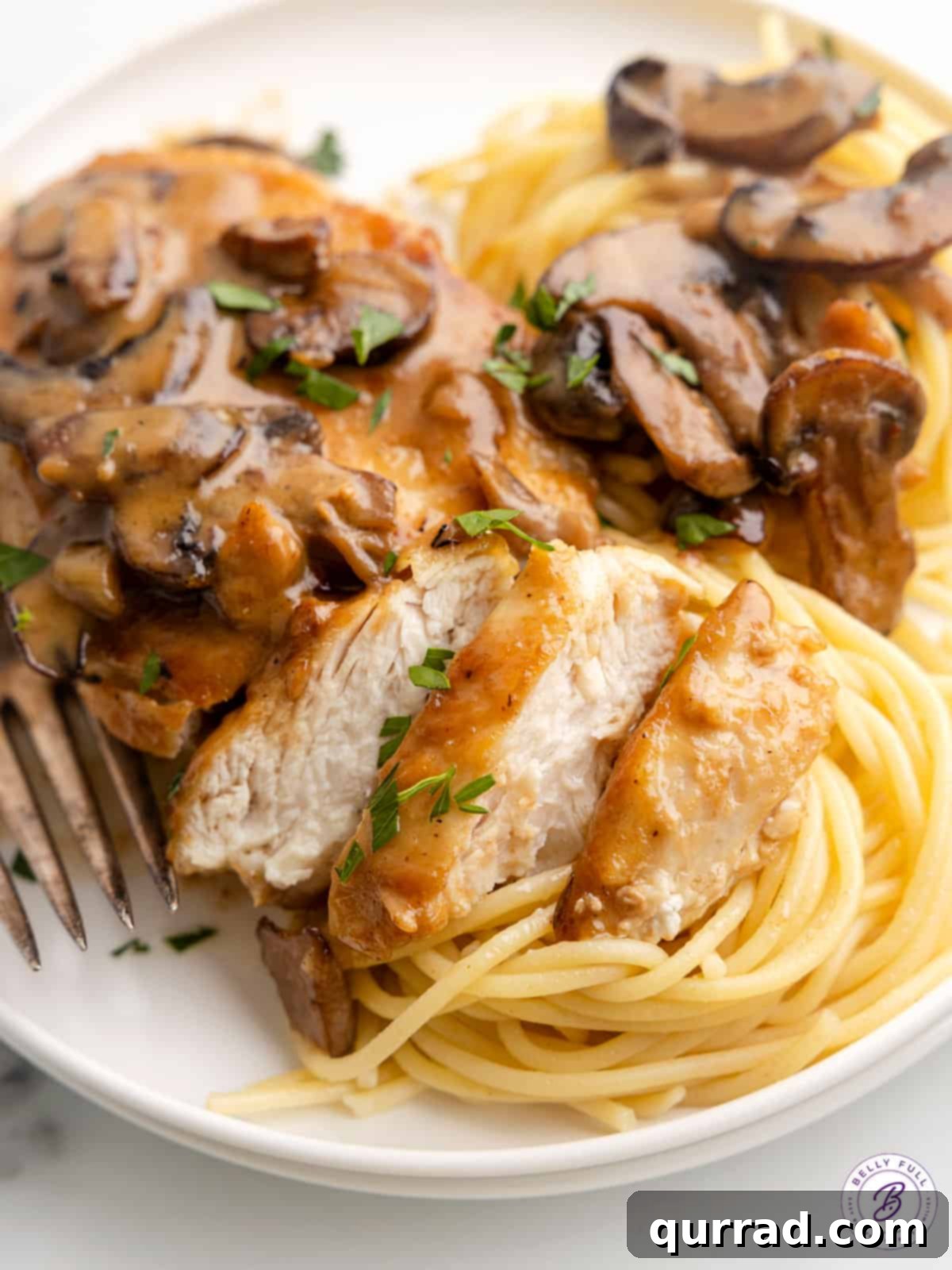 Chicken marsala over spaghetti noodles.