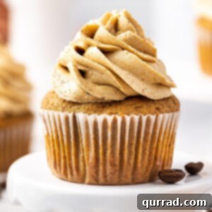 A coffee cupcake with coffee buttercream frosting