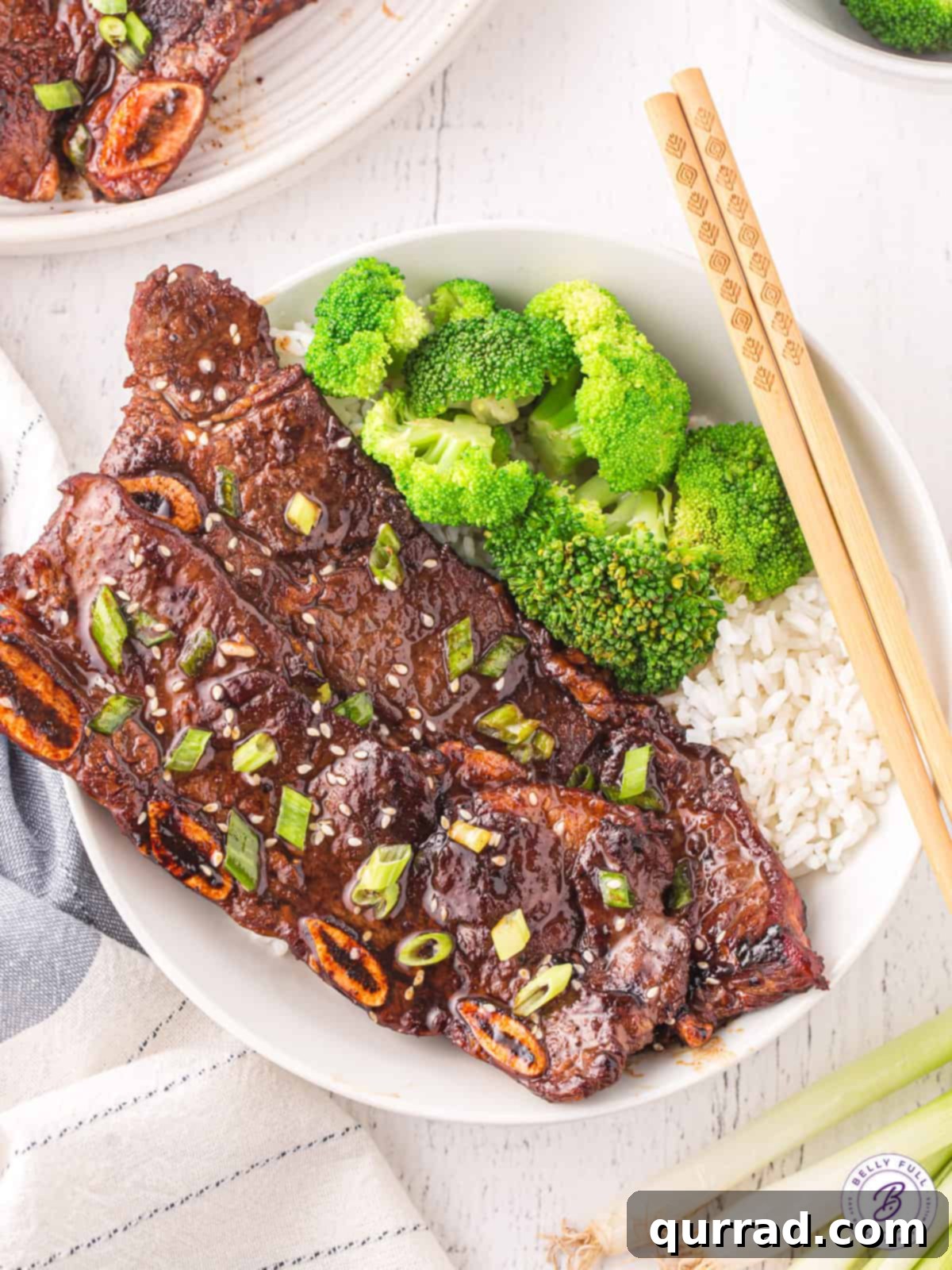 Korean Short Ribs (Kalbi Korean BBQ) - Perfectly Grilled Plate of Kalbi Korean BBQ Ribs with broccoli and rice, showcasing perfectly cooked, marinated short ribs.
