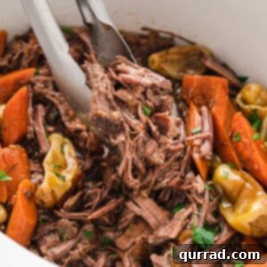 Tongs serving slow cooker Mississippi Pot Roast