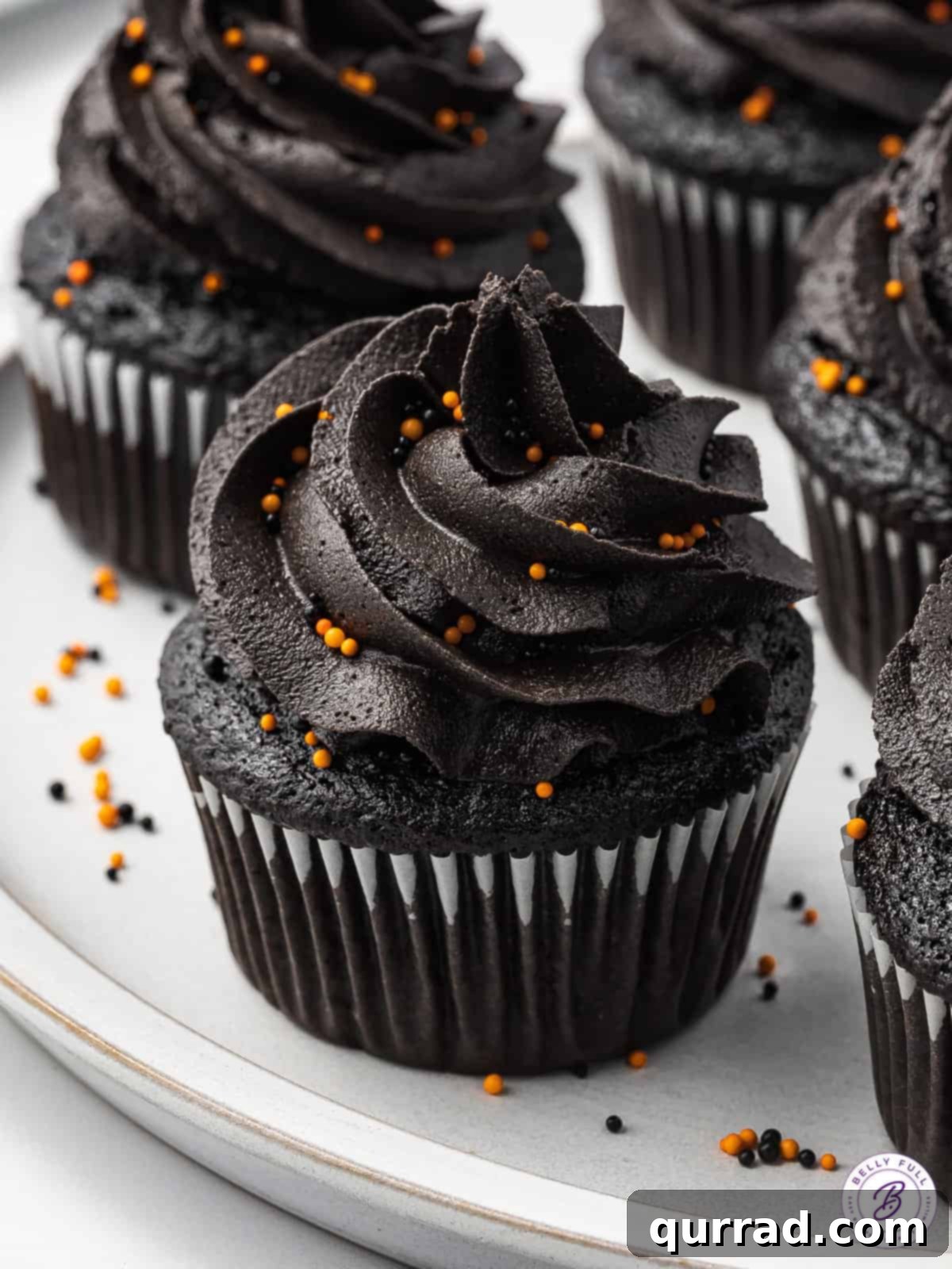 Black velvet cupcakes on a white tray