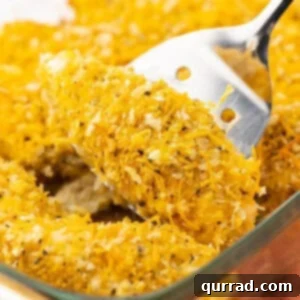 A spatula serving a cheddar baked chicken tender