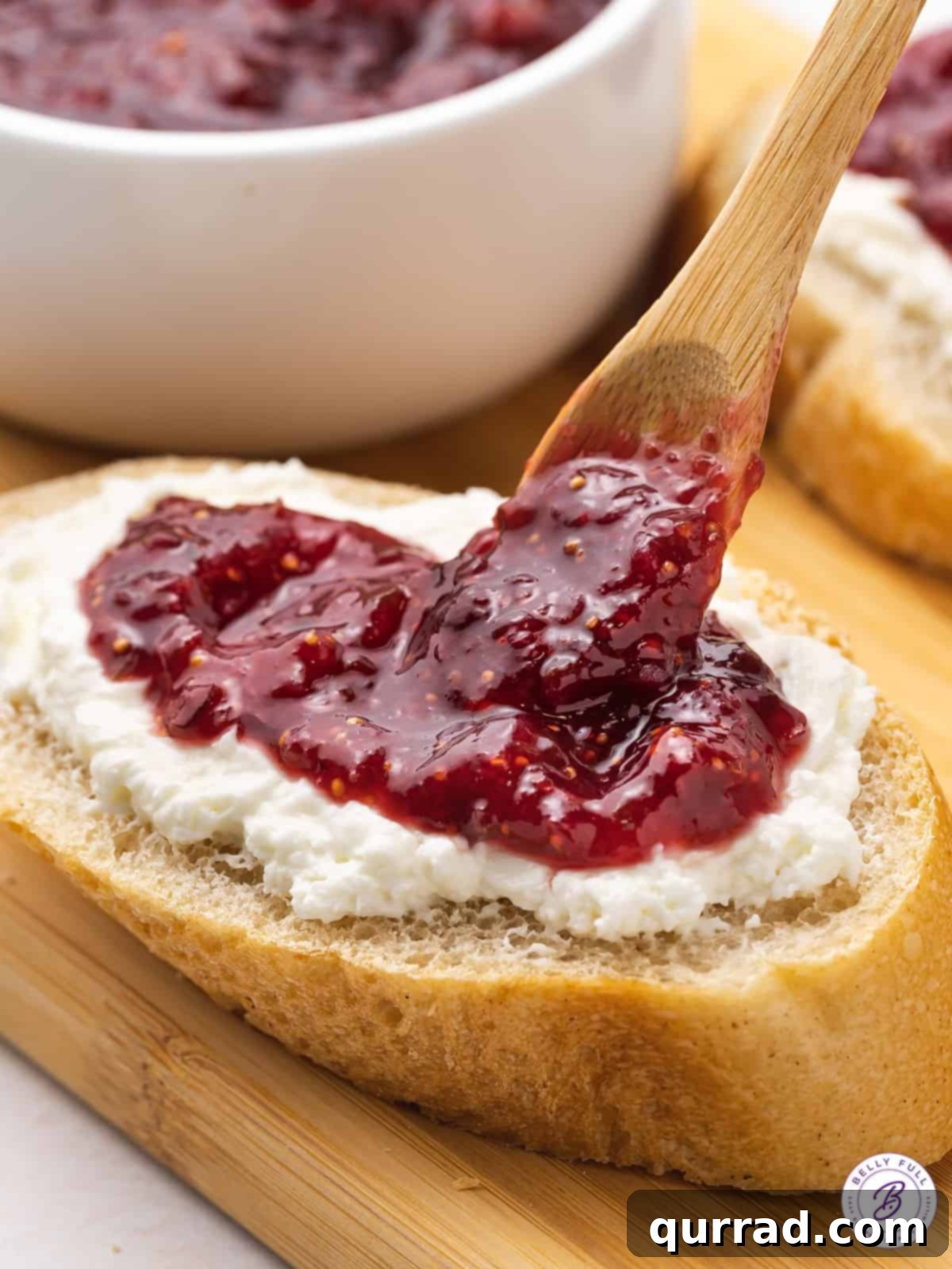 Artisan Fig Spread 5 jam being spooned on top of cottage cheese